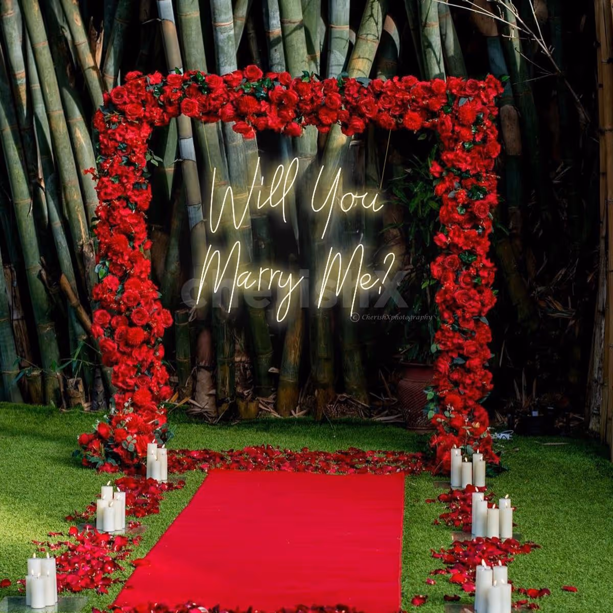 A red floral backdrop on the stand creates a bold focal point for the proposal.