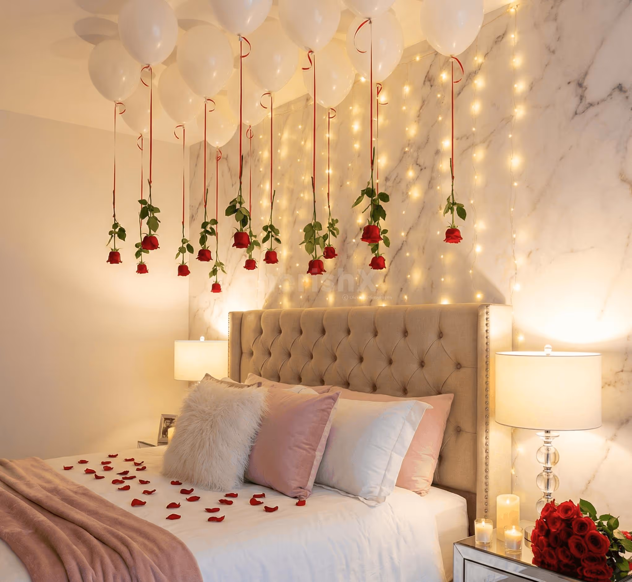 Valentine bedroom decoration with hanging red roses and white ceiling balloons