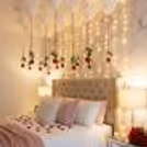 Valentine bedroom decoration with hanging red roses and white ceiling balloons
