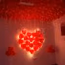 glowing red heart decor with balloons