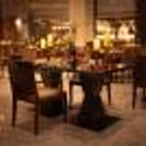 Elegant table décor with candles and rose petals for a luxurious indoor dining experience