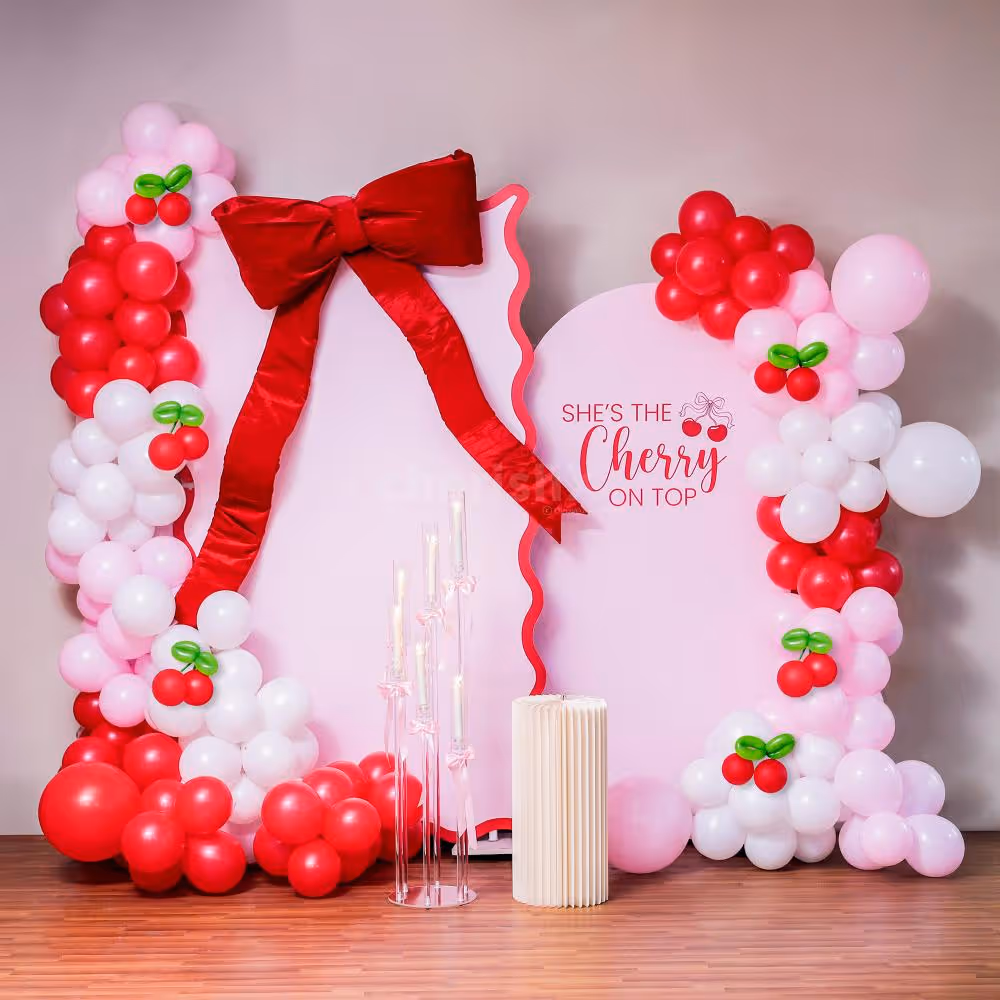 A sunboard cutout on the stand, with a birthday message, narrates the reason for the celebration.