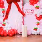 The massive red velvet bow adds energy with its passionately deep colour and size.