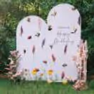 The themed cake table and flower channels ensure that floral colors make everyone cheer
