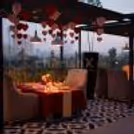 Elegant table décor with LED candles and rose petals under the open sky