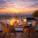 beautifully decorated candlelight table with pool view under the open sky