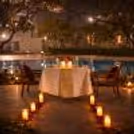 Romantic open-air dining with LED candles and rose petals