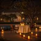 Elegant candlelight table setup by the poolside garden