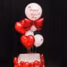 Surprise box decorated with red hearts