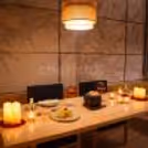 Romantic Asian fine dining with soft candlelight and rose petals