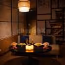 Asian fine dining with soft candlelight and rose petal décor