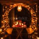 Vibrant Table Setup – A beautifully decorated table with candles and flower petals awaits.