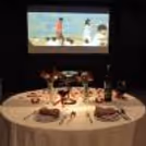 Candlelight dining followed by a romantic movie under soft lights