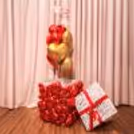 Red heart foil balloons symbolize love and deep romantic emotions