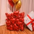 Floating balloons rise gracefully to reveal a beautiful love surprise