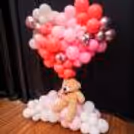 Pastel heart balloons create a dreamy and romantic gift and backdrop