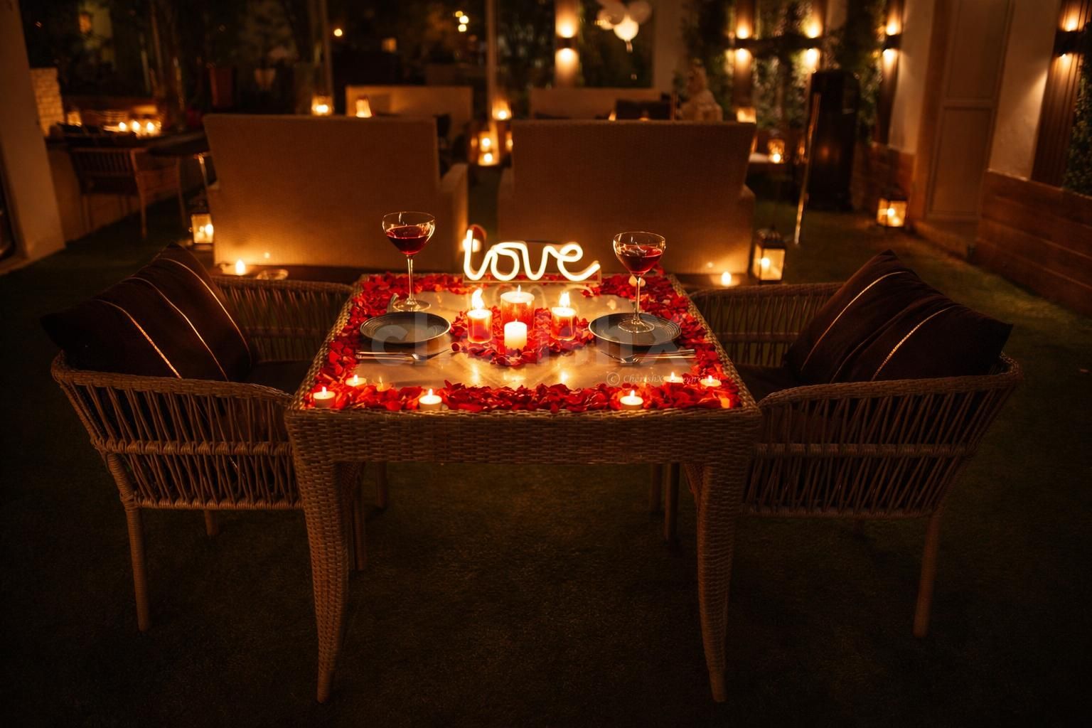 romantic candlelight dinner setup with cozy outdoor seating