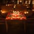 romantic candlelight dinner setup with cozy outdoor seating