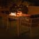 beautifully decorated table with candles and warm lighting