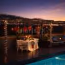 Private poolside dining with Valentine décor, candlelight ambience, and luxury seating