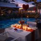 An intimate Valentine celebration by the pool with curated dining and romantic lighting