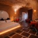 cave-themed luxury suite with warm romantic lighting