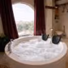 private jacuzzi inside an exclusive cave-style room