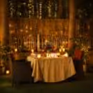 Elegant outdoor dinner table under soft evening lights