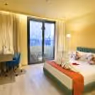 Overnight Stay For A Couple In A Deluxe Room With Beautiful Towels And Rose Petals Decoration.
