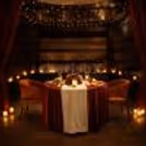 Romance meets elegance with rose-filled décor, sparkling wine, and a dreamy cabana setup by the pool.