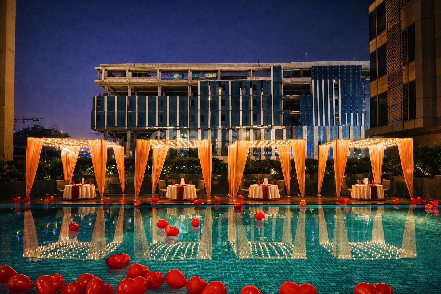 Couple dining at poolside cabana at Holiday Inn