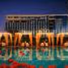 Couple dining at poolside cabana at Holiday Inn