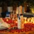 Experience a World of Elegance and Charm With A Romantic Table and Flickering Candles.
