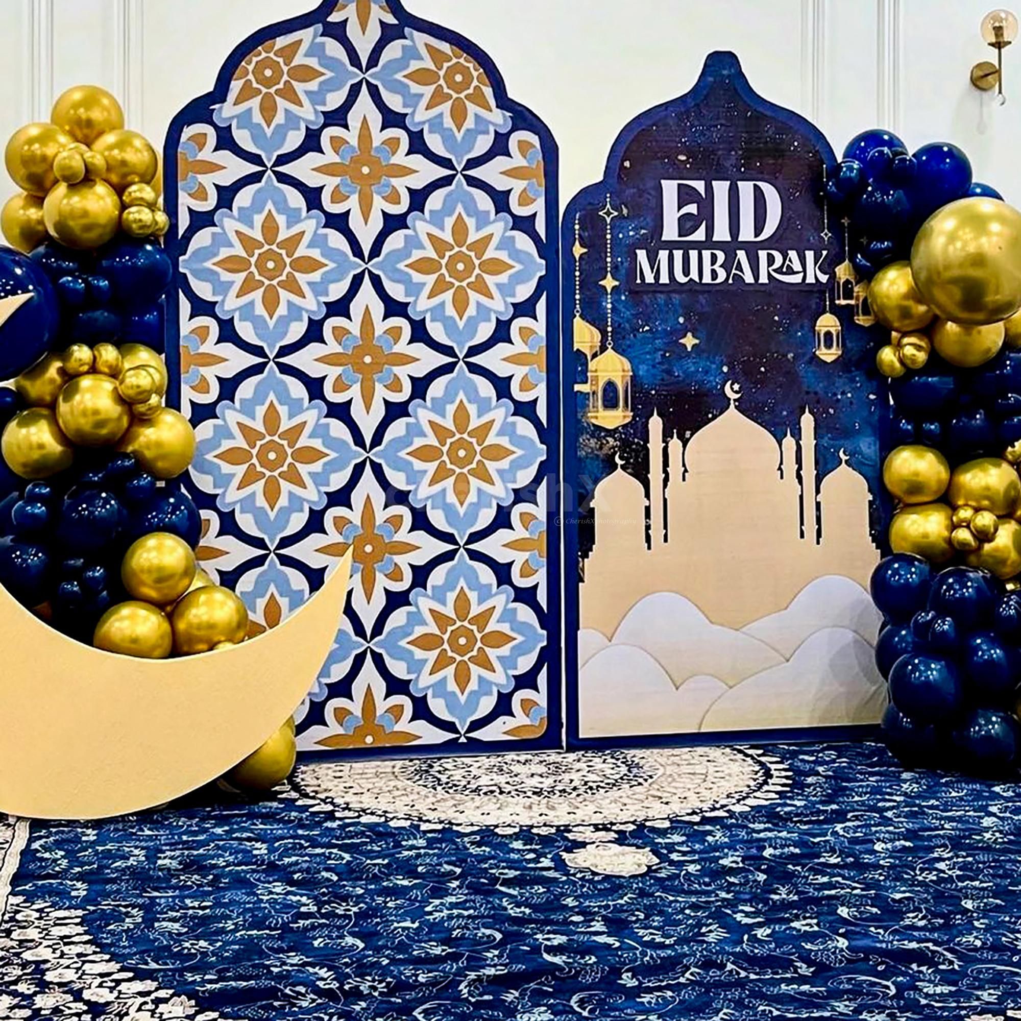 Balloon arch created with night blue and golden colours frames the setup beautifully for photo moments