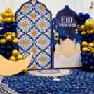 Balloon arch created with  night blue and golden colours frames the setup beautifully for photo moments