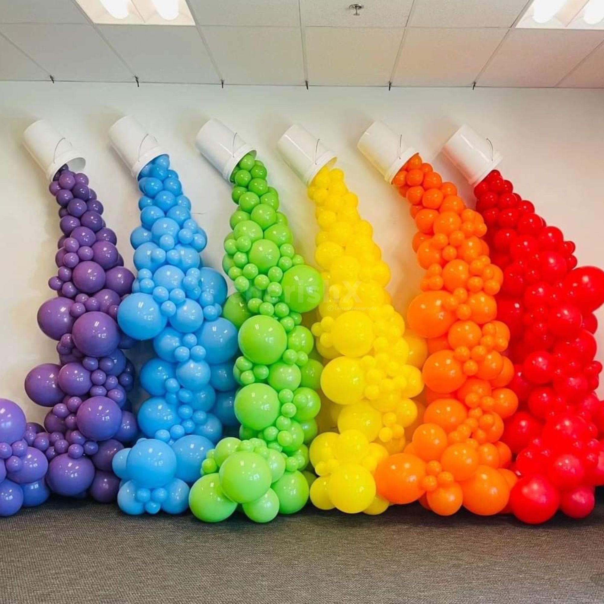 Red and yellow balloons are party essential tones for Holi fun