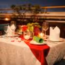 Revel in the warm glow of candles and floral beauty on your special night