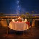 An enchanting table setup under the open sky, perfect for lovebirds