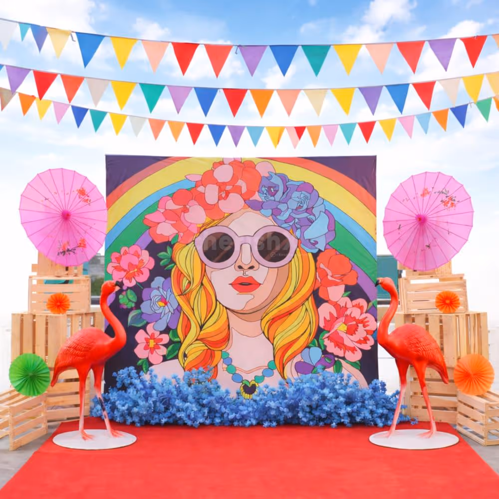 Vibrant artificial flowers enhance the Holi flex banner look, adding a natural feel