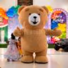 A premium teddy bear mascot adds a fun and adorable touch to the celebration.