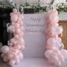 A charming pink-themed setup with bow decor creates a beautiful party atmosphere.
