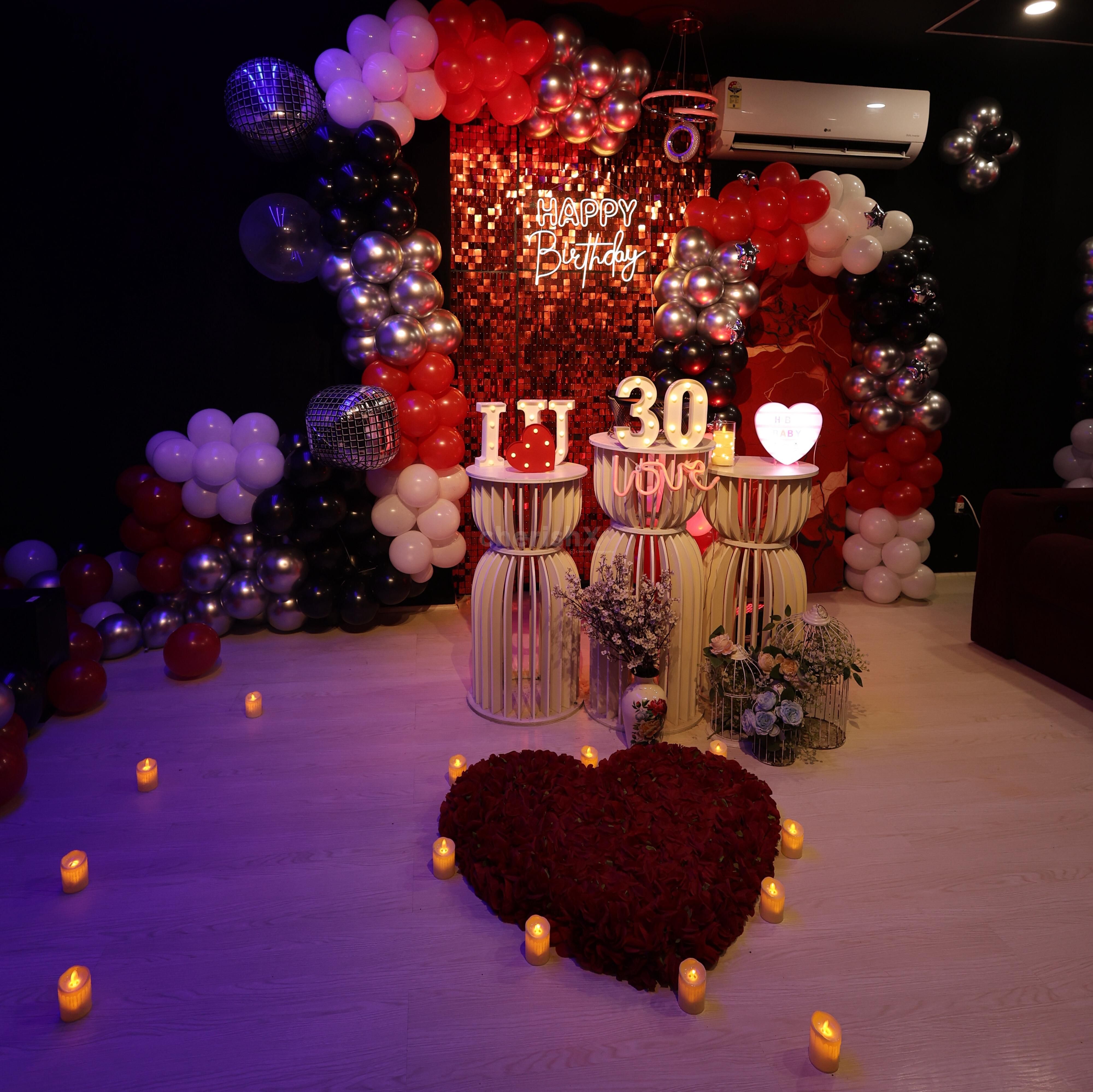 Aesthetic romantic room decoration for a private movie night with your partner.