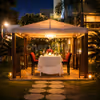 An intimate cabana candlelight dining setup at Hilton Baani Square, perfect for a magical evening under the stars.
