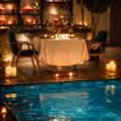 A dreamy poolside candlelight dining experience at Expo in Greater Noida, curated for couples seeking a magical evening under soft lights and luxury ambiance.