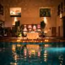 Celebrate love beside the serene pool at Expo, Greater Noida with a romantic candlelight dinner setup designed for unforgettable moments.