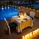 Celebrate love under the open sky with an elegant rooftop poolside candlelight dinner at Radisson Paschim Vihar, Delhi.