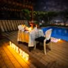 Romance meets luxury with this rooftop poolside candlelight dining experience at Radisson Paschim Vihar, Delhi.