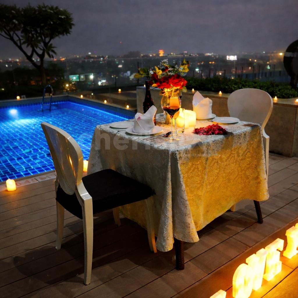An intimate rooftop poolside candlelight dining experience at Radisson Paschim Vihar, Delhi perfect for romantic celebrations.