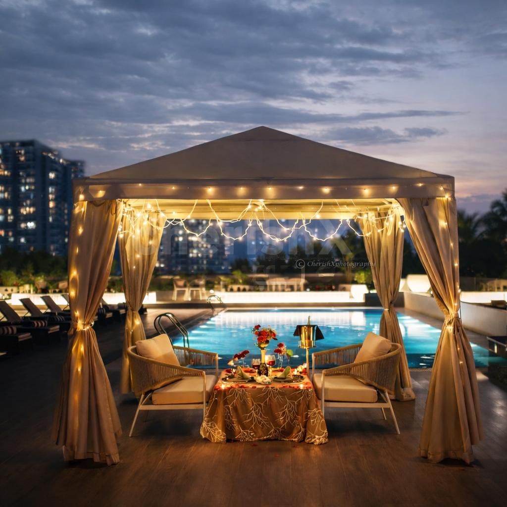 A luxurious candlelight dinner setup in a private rooftop cabana at Hilton Baani Square.