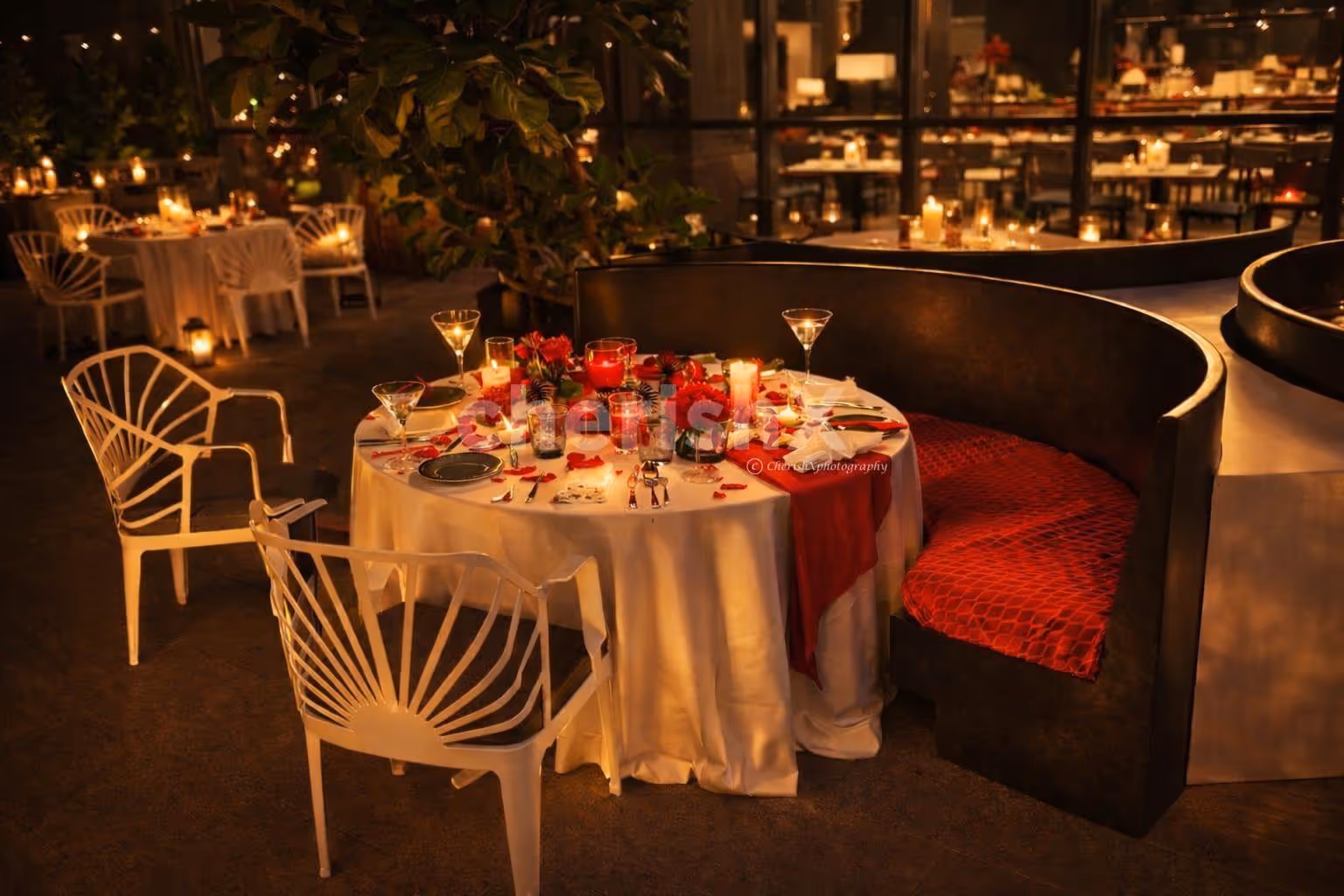 An enchanting alfresco candlelight dinner at Hilton Manyata Tech Park, where soft lights and open skies set the perfect romantic mood.